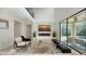 Open living area features a modern fireplace and sliding doors leading to a pool at 17923 Polo Trl, Bradenton, FL 34211