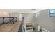 Open loft with hardwood floors, fireplace, and large windows at 17923 Polo Trl, Bradenton, FL 34211
