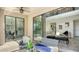 Covered patio with glass doors opening to living area at 17923 Polo Trl, Bradenton, FL 34211