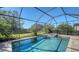 Inviting screened-in pool with spa, surrounded by a paved patio at 17923 Polo Trl, Bradenton, FL 34211