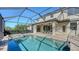 Screened pool and spa with view of house exterior at 17923 Polo Trl, Bradenton, FL 34211