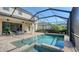 Relaxing screened-in pool and spa with patio furniture at 17923 Polo Trl, Bradenton, FL 34211