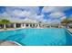 Resort-style pool with ample deck space and clubhouse view at 17923 Polo Trl, Bradenton, FL 34211