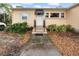 House with a white door and a walkway at 204 80Th N Ave, St Petersburg, FL 33702