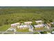 Aerial view showcasing condo building and surrounding landscape at 209 Rubens Dr # F, Nokomis, FL 34275