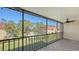 Screened balcony overlooking the pool and surrounding landscape at 209 Rubens Dr # F, Nokomis, FL 34275