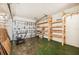 Garage with built-in shelving and a lawnmower at 2101 25Th W Ave, Bradenton, FL 34205