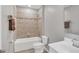 Bathroom with tub, toilet and updated vanity at 2179 W Price Blvd, North Port, FL 34286