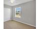Spacious bedroom with window and ceiling fan at 2179 W Price Blvd, North Port, FL 34286