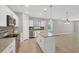 Modern kitchen with white cabinets, granite countertops, and stainless steel appliances at 2179 W Price Blvd, North Port, FL 34286