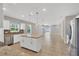 Modern kitchen featuring white cabinets, granite countertops, and stainless steel appliances at 2179 W Price Blvd, North Port, FL 34286