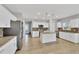 Modern kitchen with white cabinets, granite countertops, and stainless steel appliances at 2179 W Price Blvd, North Port, FL 34286