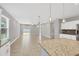 Modern kitchen with island, granite countertops, and stainless steel appliances at 2179 W Price Blvd, North Port, FL 34286