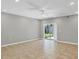 Spacious living room with tile floors and sliding glass doors at 2179 W Price Blvd, North Port, FL 34286
