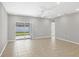 Bright living room with tile floors and sliding glass doors leading to the backyard at 2179 W Price Blvd, North Port, FL 34286
