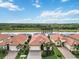 Aerial view of a home with a canal view in a luxury community at 25119 Spartina Dr, Venice, FL 34293