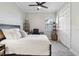 Bright bedroom with a queen bed, built-in shelving, and plenty of natural light at 25119 Spartina Dr, Venice, FL 34293