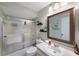 Bathroom with a shower/tub combo, vanity, and mirror at 2579 Countryside Blvd # 1210, Clearwater, FL 33761