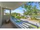 Private balcony overlooking a tree-lined street at 2586 Prospect St, Sarasota, FL 34239