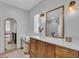 Well-lit bathroom featuring wood cabinetry, a vanity area, and stylish fixtures at 2586 Prospect St, Sarasota, FL 34239