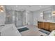 Modern bathroom with a walk-in glass shower, dual vanities, and contemporary lighting at 2586 Prospect St, Sarasota, FL 34239