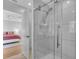 Modern bathroom features a glass-enclosed shower with white tiles and stainless steel fixtures at 2586 Prospect St, Sarasota, FL 34239