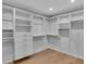 Organized walk-in closet with custom shelves and drawers for optimal storage solutions at 2586 Prospect St, Sarasota, FL 34239