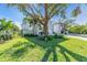 Attractive curb appeal with lush lawn and large tree at 2586 Prospect St, Sarasota, FL 34239