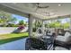 Relaxing outdoor patio with wicker furniture and built-in grill at 2586 Prospect St, Sarasota, FL 34239