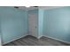 Light blue bedroom with laminate flooring and a closet at 2908 98Th E Ave, Parrish, FL 34219