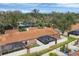 An aerial view of a residential community with a focus on the building's exterior and landscaping at 2917 Park Lake Dr # 2917, Bradenton, FL 34209