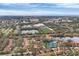 Wide aerial view of community, highlighting its proximity to the water and other amenities at 2917 Park Lake Dr # 2917, Bradenton, FL 34209