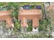 Aerial view of community featuring multiple buildings, lush landscaping, and a tennis court at 2917 Park Lake Dr # 2917, Bradenton, FL 34209