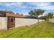 Landscaped backyard with a fenced area and plenty of green space at 2917 Park Lake Dr # 2917, Bradenton, FL 34209