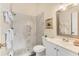 Clean bathroom with marble shower, white vanity, and updated fixtures at 2917 Park Lake Dr # 2917, Bradenton, FL 34209