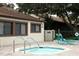 Relaxing community spa with seating and a tiled deck at 2917 Park Lake Dr # 2917, Bradenton, FL 34209