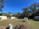 Large backyard with shed and partially damaged fence at 3006 N Oriente Ave, Sarasota, FL 34235