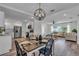 Modern kitchen with white cabinets, stainless steel appliances, and a farmhouse table at 3208 18Th Ave W, Bradenton, FL 34205