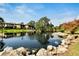 Pond view of condo community with lush foliage at 3415 Wild Oak Bay Blvd # 427, Bradenton, FL 34210