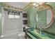 Charming bathroom with tub and glass-top vanity at 3614 E 62Nd Ave, Bradenton, FL 34203