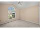 Bedroom with vaulted ceiling, window, and ceiling fan at 3614 E 62Nd Ave, Bradenton, FL 34203