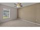 Bright bedroom featuring a window and ceiling fan at 3614 E 62Nd Ave, Bradenton, FL 34203