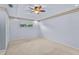 Spacious bedroom with ceiling fan and carpet flooring at 3614 E 62Nd Ave, Bradenton, FL 34203