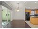 Dining room with dark hardwood floors and access to the patio at 3614 E 62Nd Ave, Bradenton, FL 34203