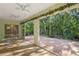 Bright enclosed patio overlooking lush backyard at 3614 E 62Nd Ave, Bradenton, FL 34203