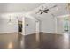 Spacious living room with dark hardwood floors and a high ceiling at 3614 E 62Nd Ave, Bradenton, FL 34203