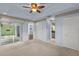 Main bedroom with light blue walls, carpeting, and access to the Florida room at 3614 E 62Nd Ave, Bradenton, FL 34203
