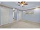 Main bedroom with light blue walls, carpeting, and a ceiling fan at 3614 E 62Nd Ave, Bradenton, FL 34203