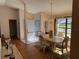 Bright dining room with a marble table and chandelier at 3615 Kingston Blvd, Sarasota, FL 34238