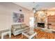 Living room featuring a stone fireplace and comfortable seating at 3615 Kingston Blvd, Sarasota, FL 34238